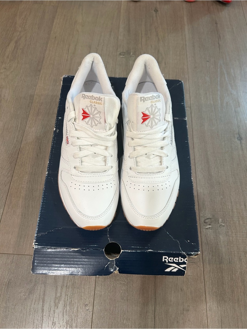 Reebok Women’s White Sneakers with Red Logo Accents